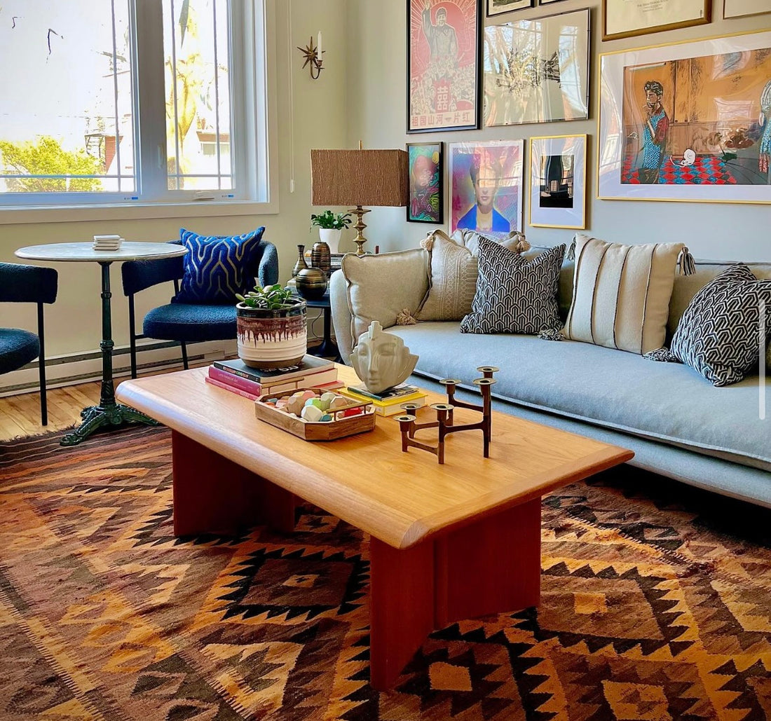 eclectic living room with mids century modern teak coffee table